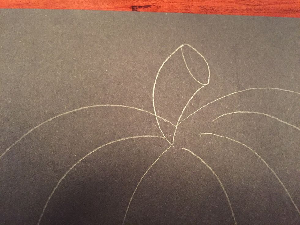 Draw a short curved line to the right of your oval to create the stem.