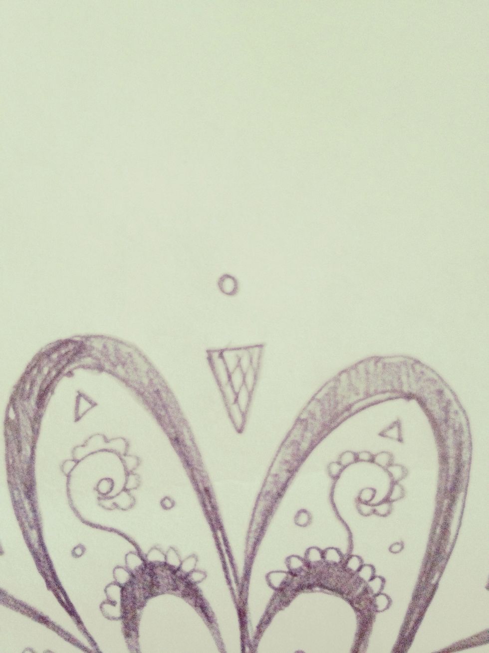 Draw a small circle above the triangles.