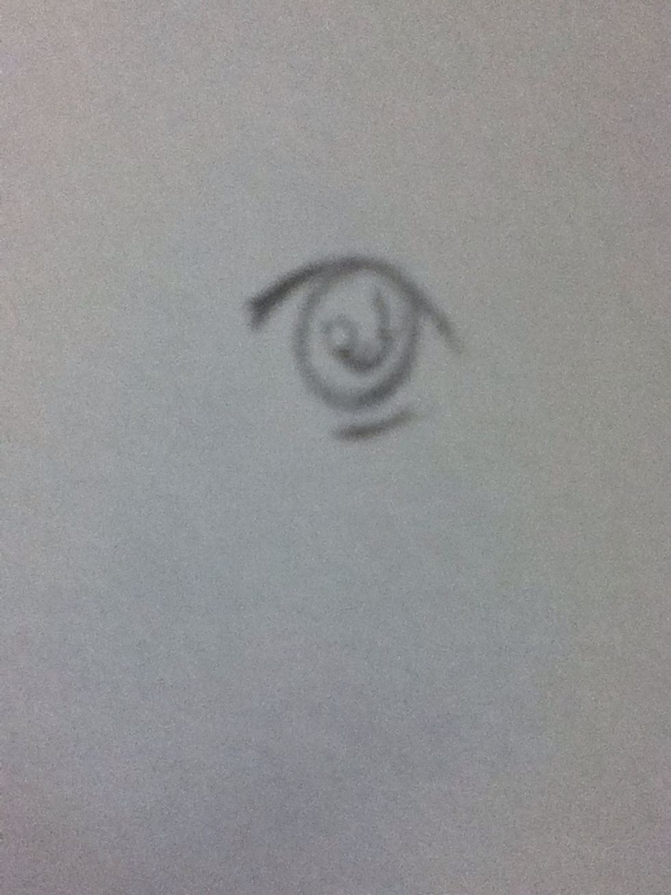 Draw a small curve in the middle for the pupil