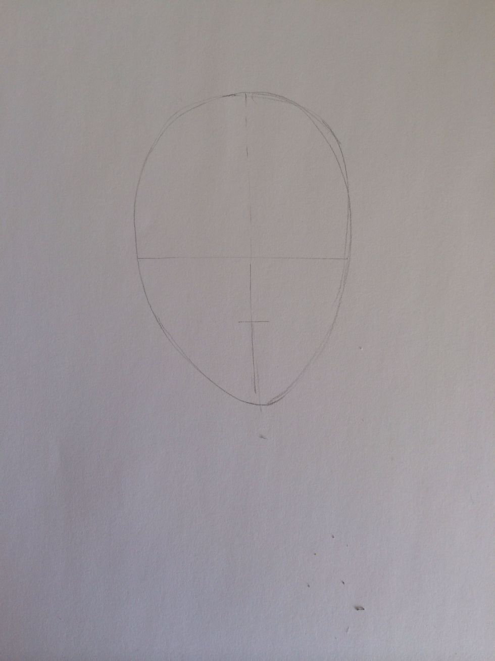 Draw a small mark halfway between the midline and the bottom of the egg (this will be the bottom of the nose)