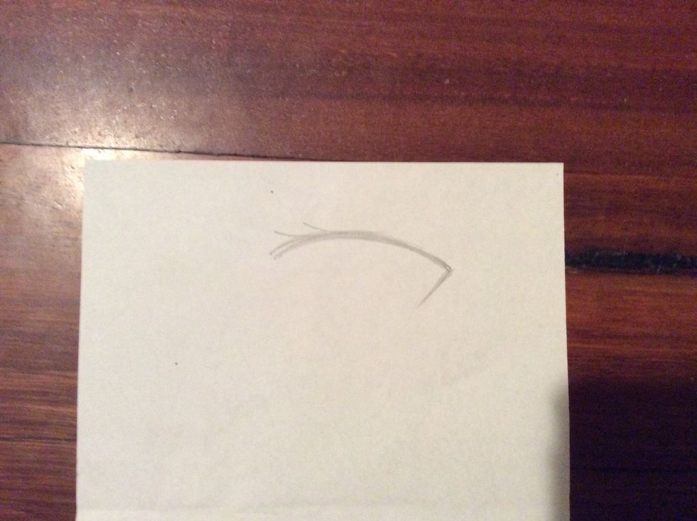 Draw a straight-ish line coming from the end of the end of the arched line, preferably the end closer to the edge of the face.