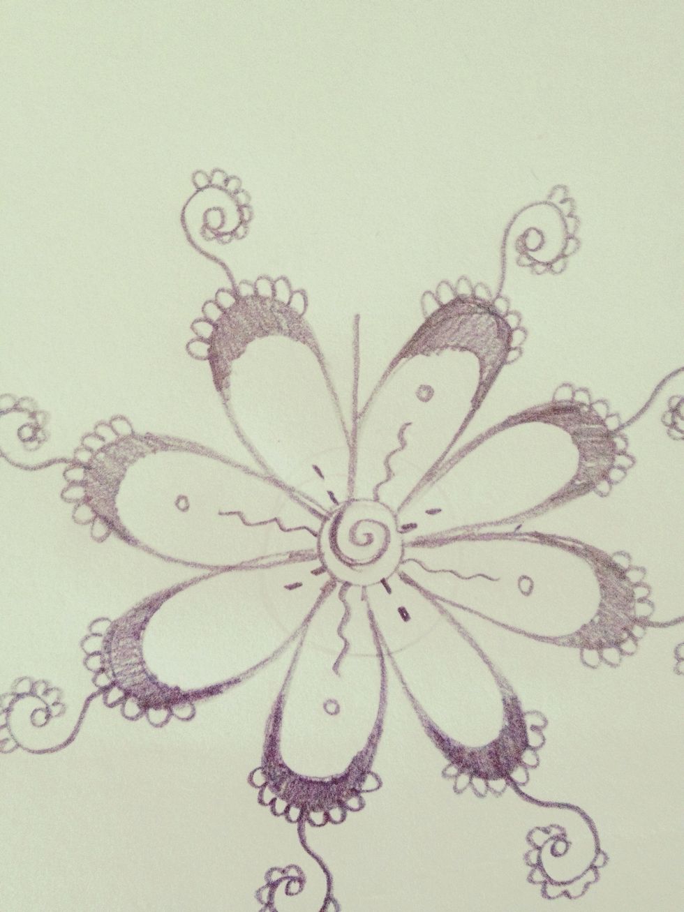 Draw a straight line from where the base of two petals meet, almost to the end of the petal.