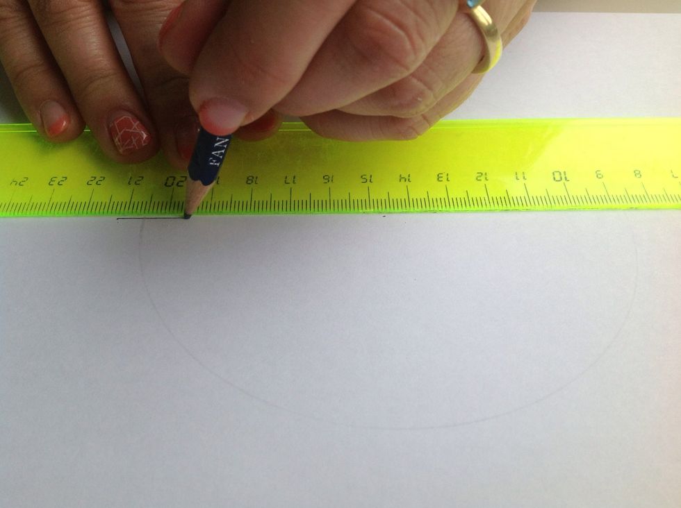 Draw a straight line through the centre of your circle.