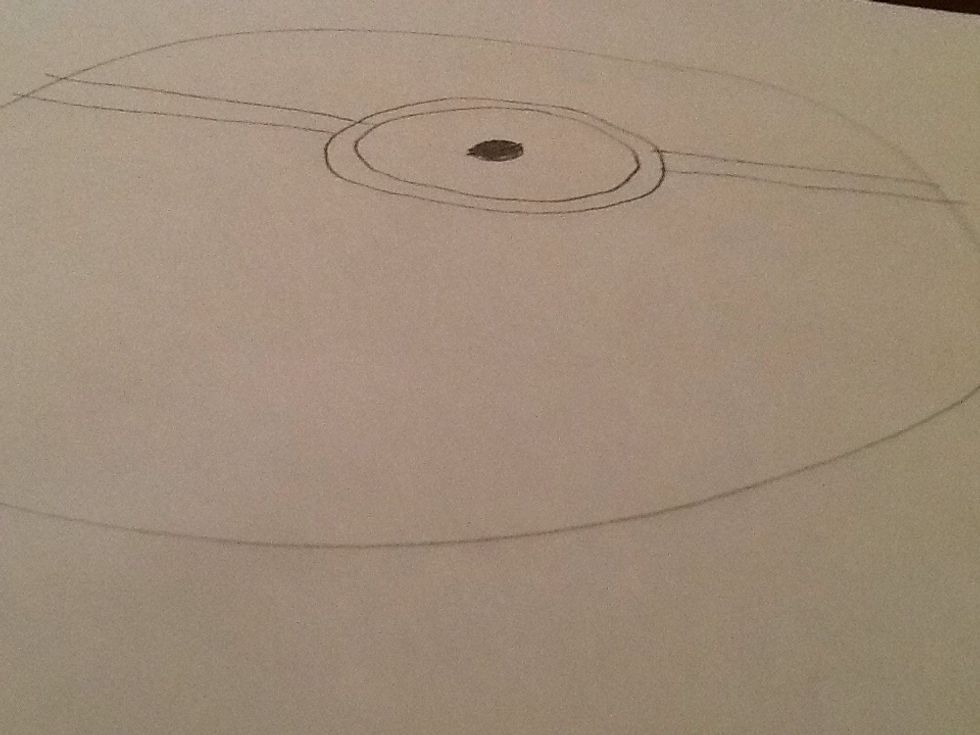 Draw a strap on either side of the eye to make goggles.