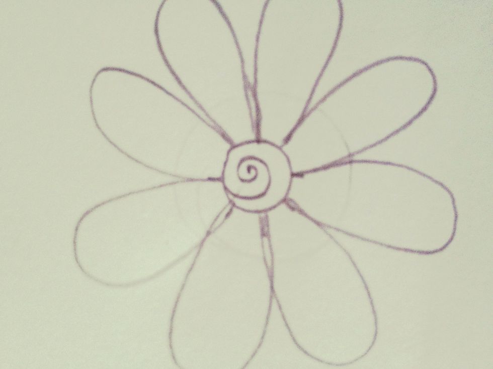Draw a swirl in the middle of the flower.