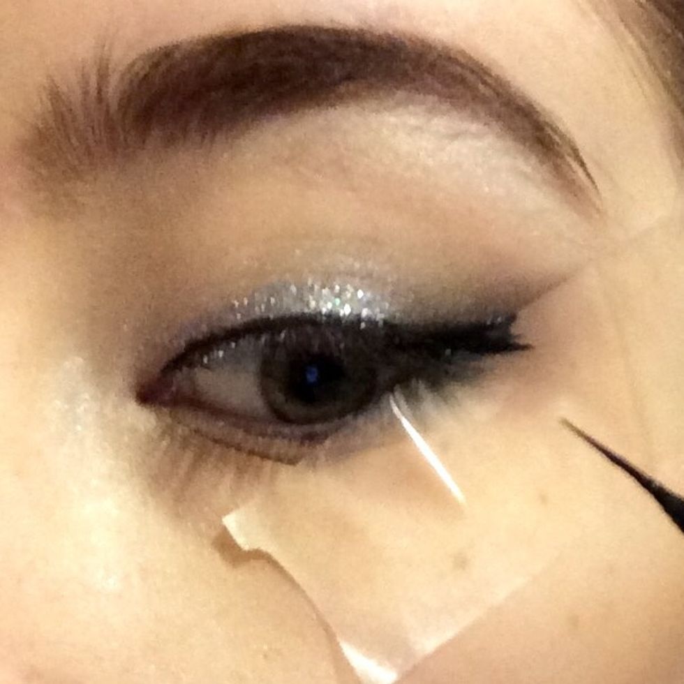 Draw a thin line, using the tap as a guide for your wing...