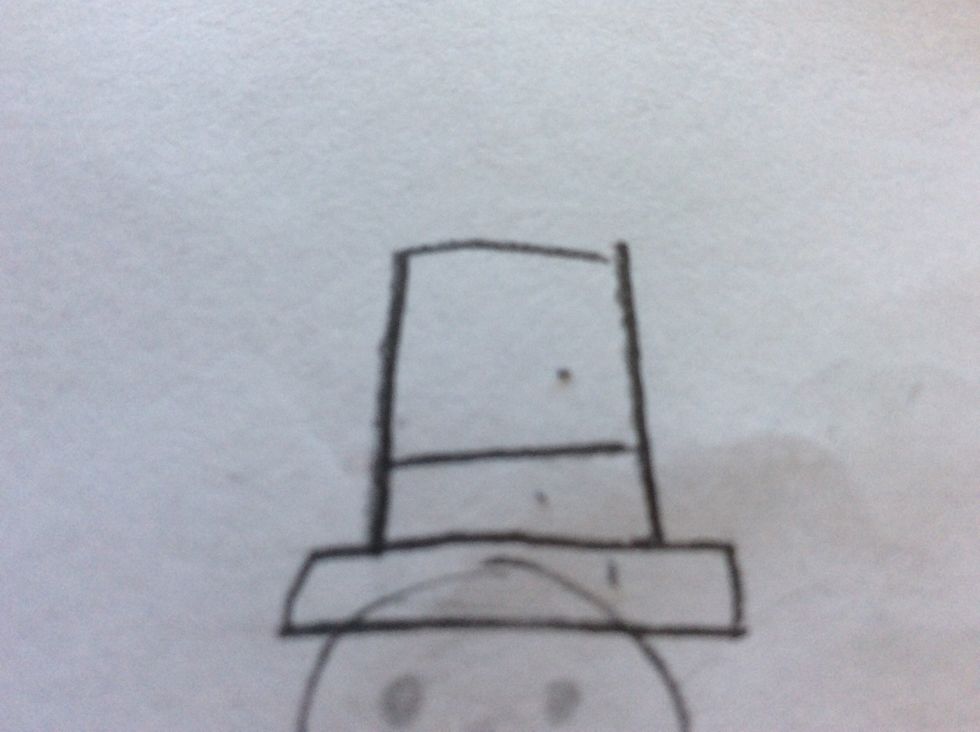 Draw a top hat on the head.