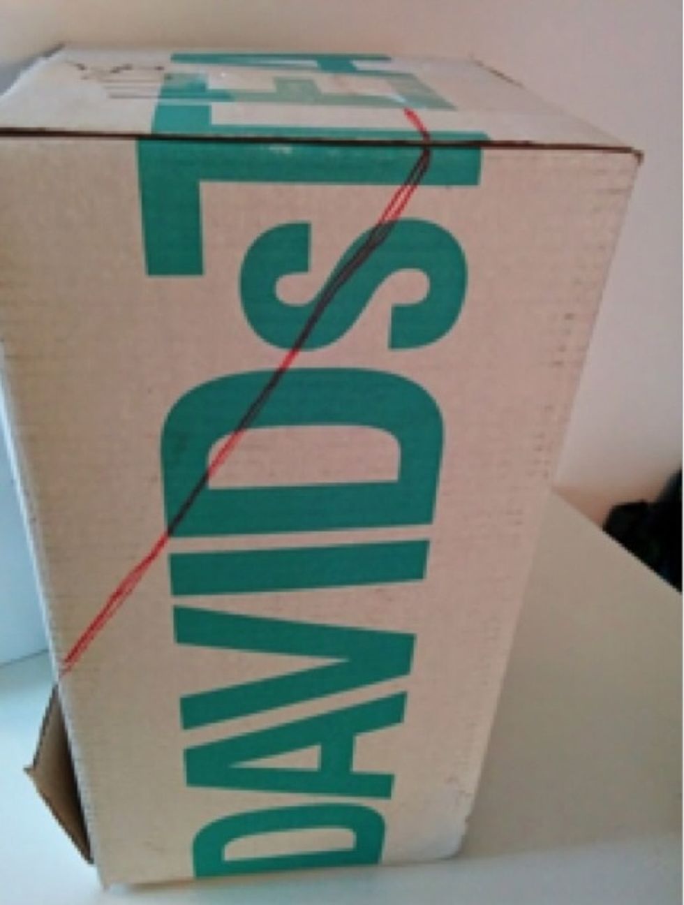 Draw a triangle starting 19cm up from the base of the box and 9cm to the side from the top. Repeat on both sides.