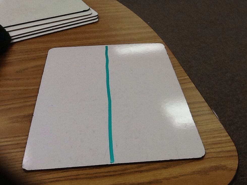 Draw a vertical line down the middle of the board so you have two sides.