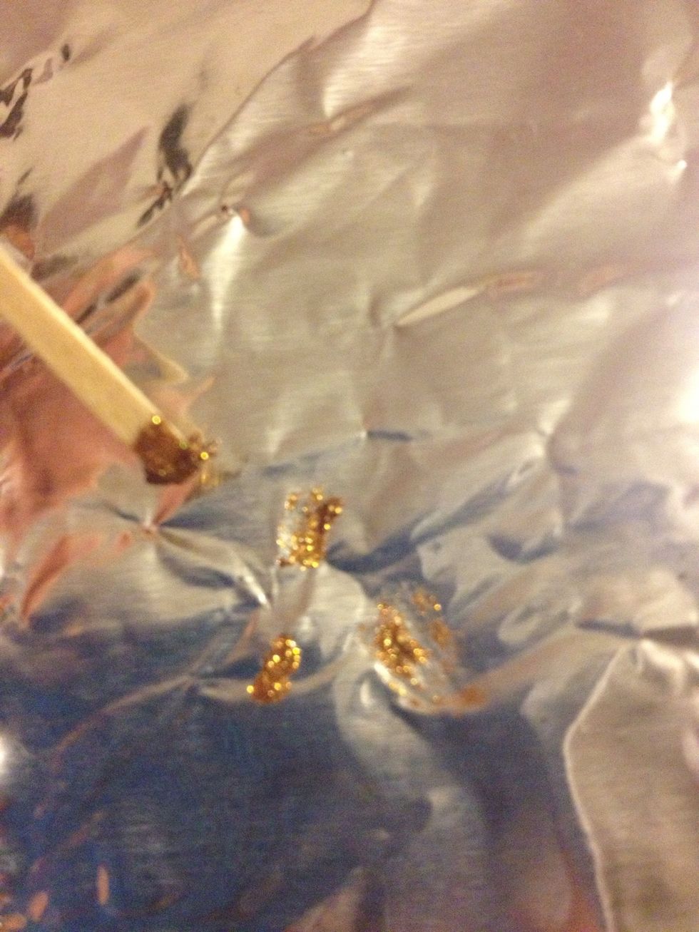 Draw abstract lines and blobs on your nails. The more you do, the cooler it looks! I did this on foil to demonstrate.