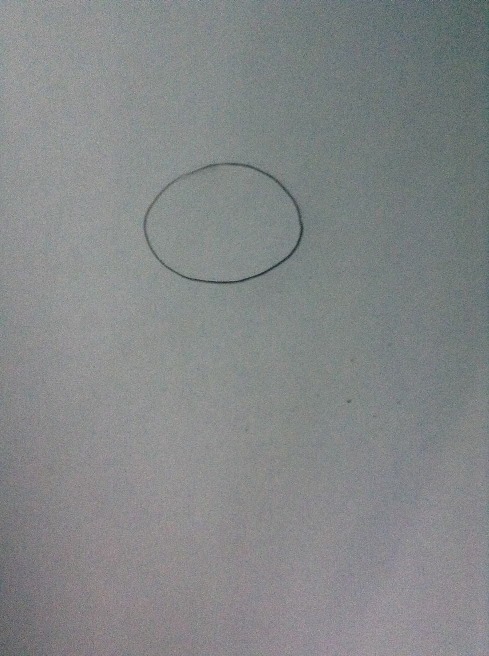 Draw an oval in the middle of your paper
