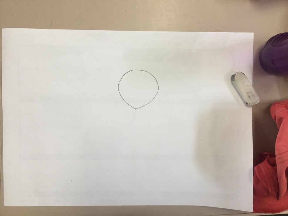 Draw an oval with a curvy point at the bottom. Try to draw it a third down the bottom of the page. This will be its face.