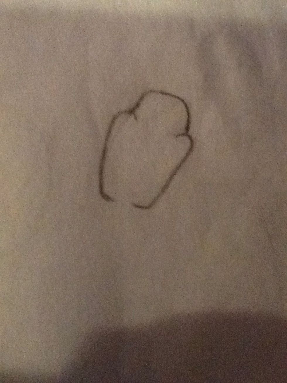 Draw an trapezoid shape to finish off the top of his head