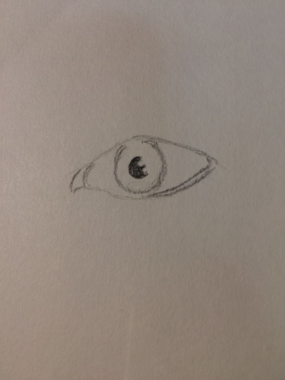 Draw and fill in the pupil like so