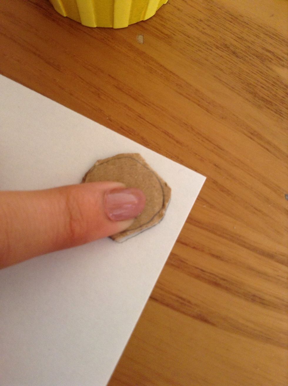 Draw around badge shape onto paper