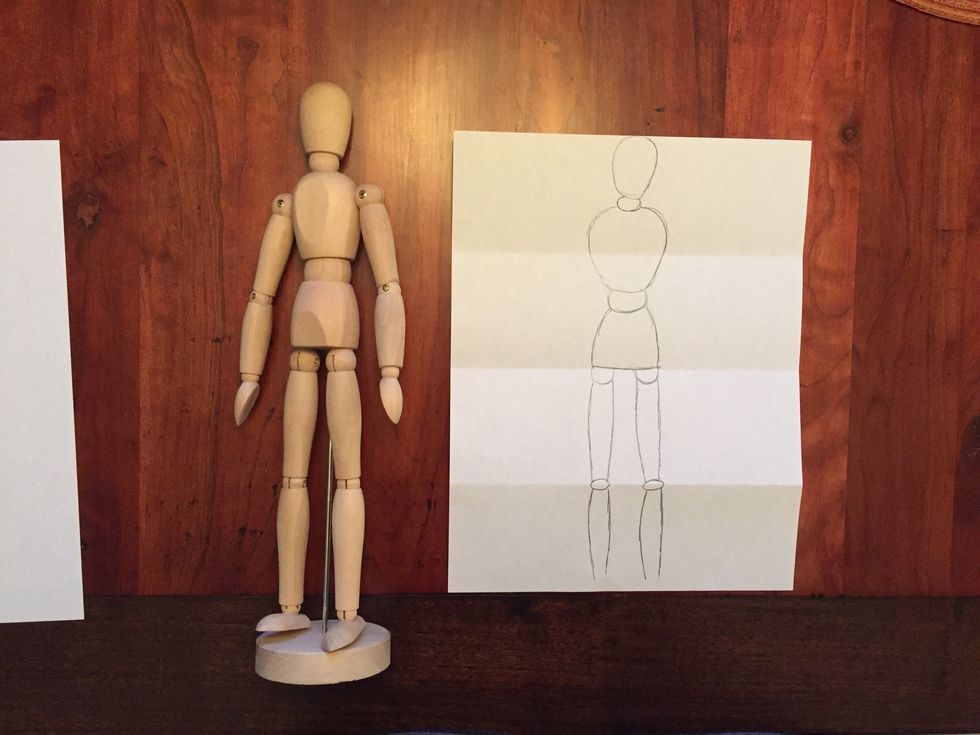 Draw Bob's calves. Bob's calves go almost to the bottom of the paper ( leave room for Bob's feet! ).