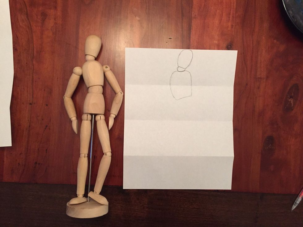 Draw Bob's chest. Bob's chest should fill the rest of the top section, should come almost half way into your second section, and should be titled the opposite way of your head.
