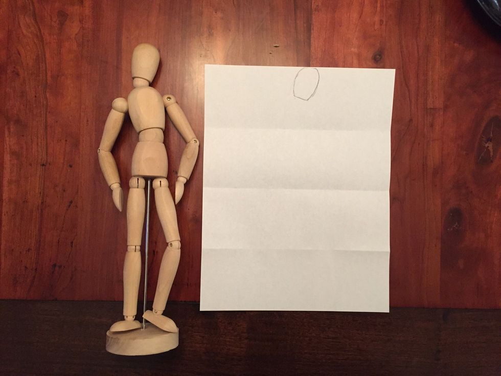 Draw Bob's head. Bob's head should touch the top of your paper, should fill half of your top section, and should be tilted a little.
