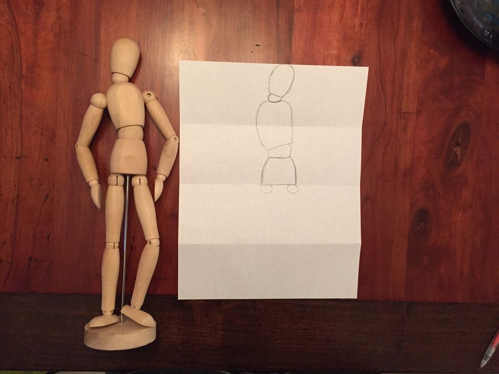 Draw Bob's hip joints. Circles on both sides of your hips.