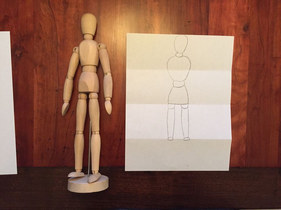 Draw Bob's knees. Bob's knees are small ovals.