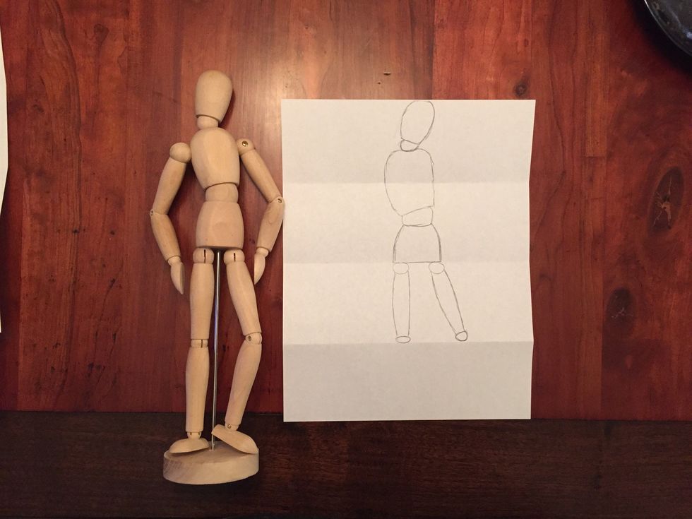 Draw Bob's knees. Ovals on the bottom fold.