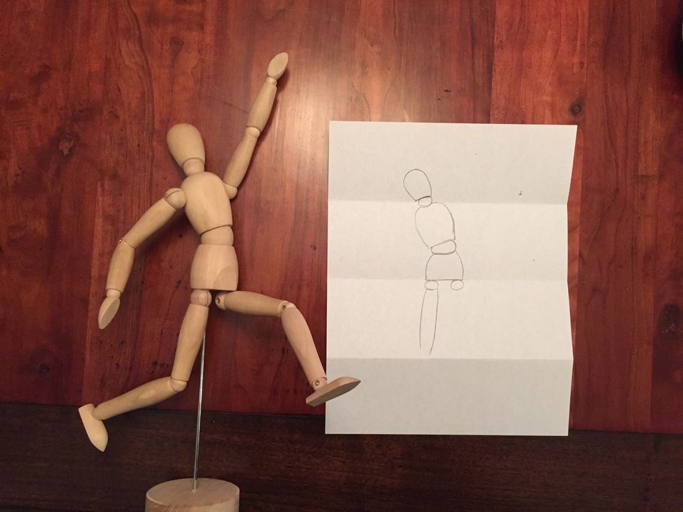 Draw Bob's left thigh. It should fill the third section, touching the bottom fold.