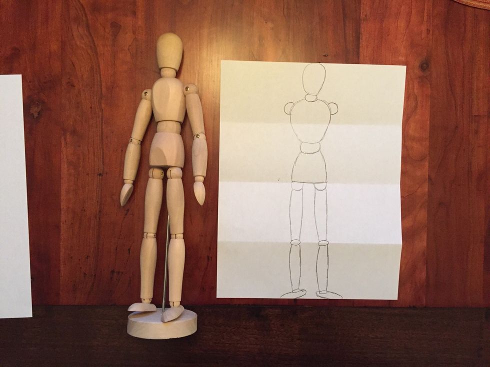 Draw Bob's shoulders. Circles on both sides of Bob's chest.