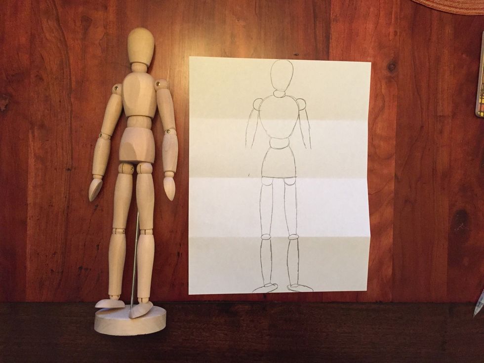 Draw Bob's upper arm. Bob's upper arm should come halfway down the second section, or to the bottom of Bob's waist.