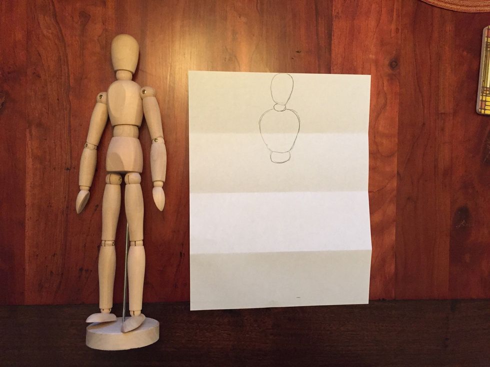 Draw Bob's waist. His waist is not too long and is thinner than his chest. You should still have half of your second section empty.