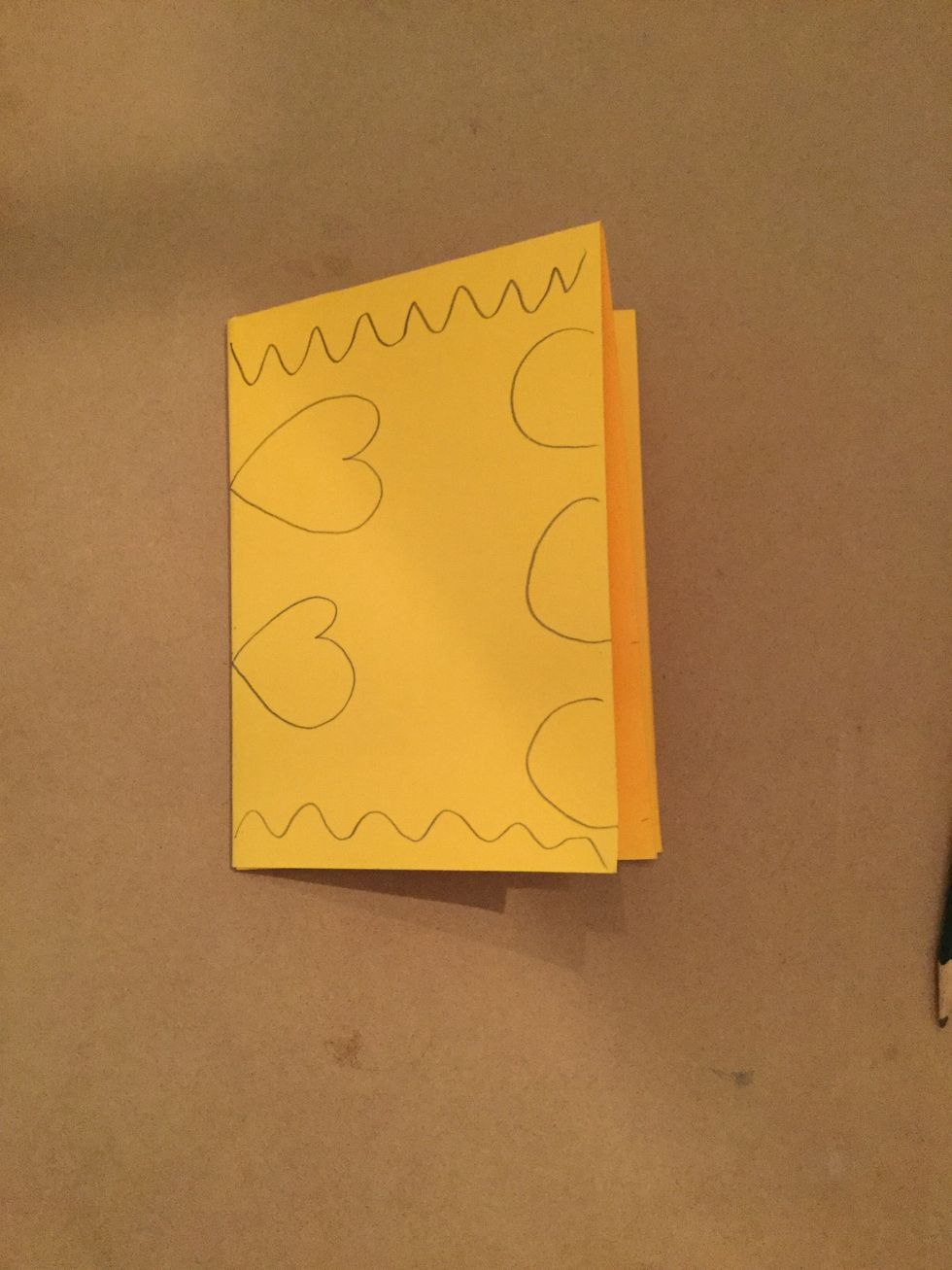 Draw designs around the outer edge of your paper.