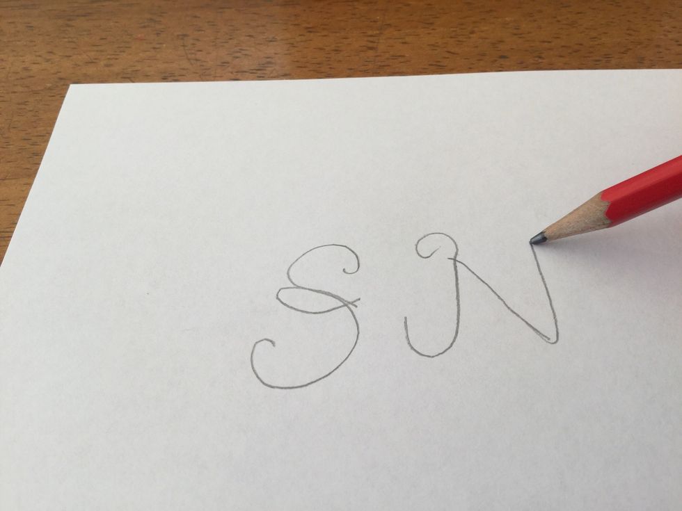Draw down a little father then draw straight up again in the normal "N" shape