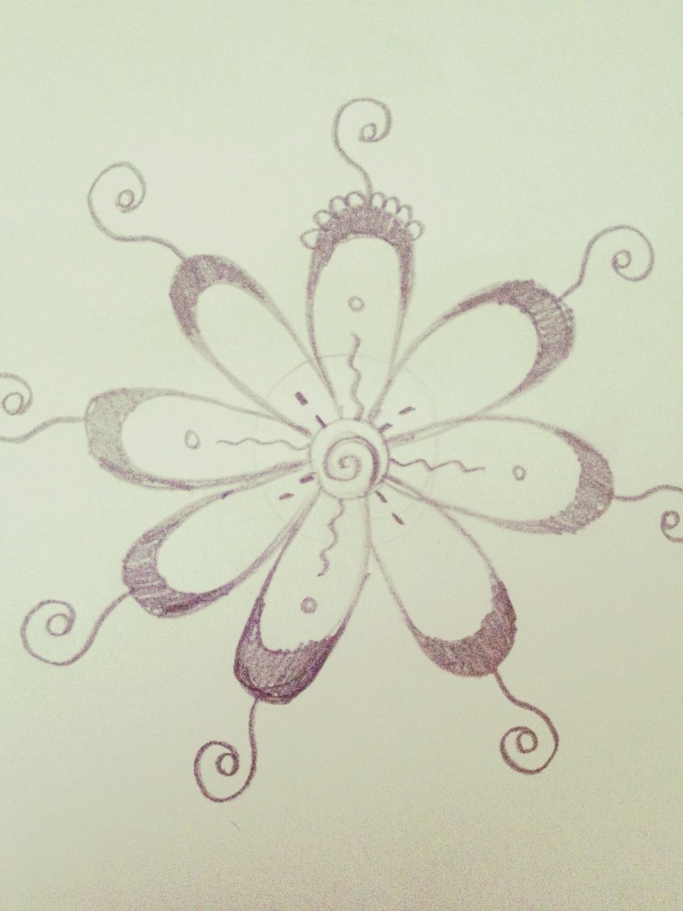 Draw eight little humps around the top of the petal next to the swirl. I did four per side, like this.