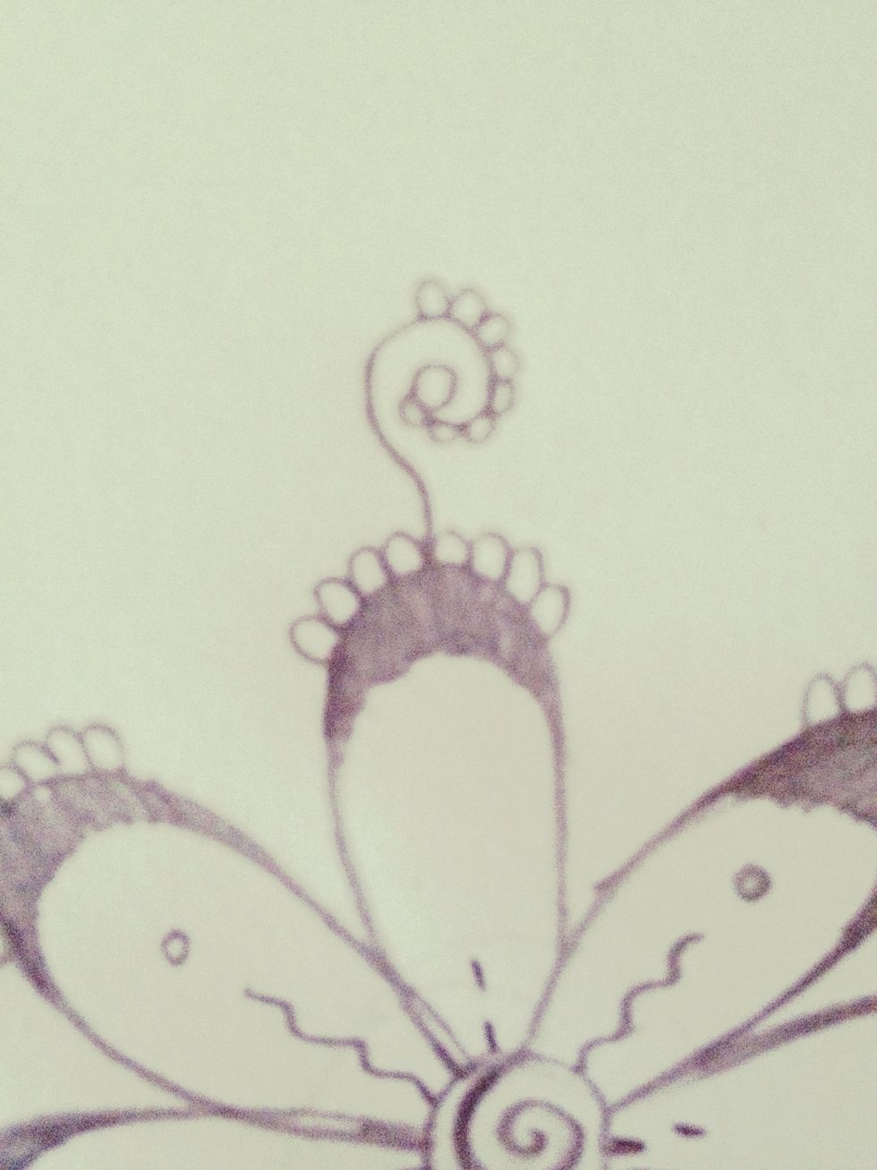 Draw eight more humps on the swirl, starting at the bottom around to the top like this.