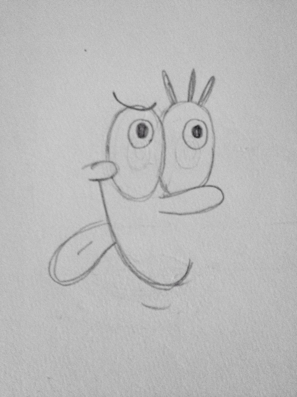 Draw his pupils and irises looking up. (They will be looking up at the soccer ball)