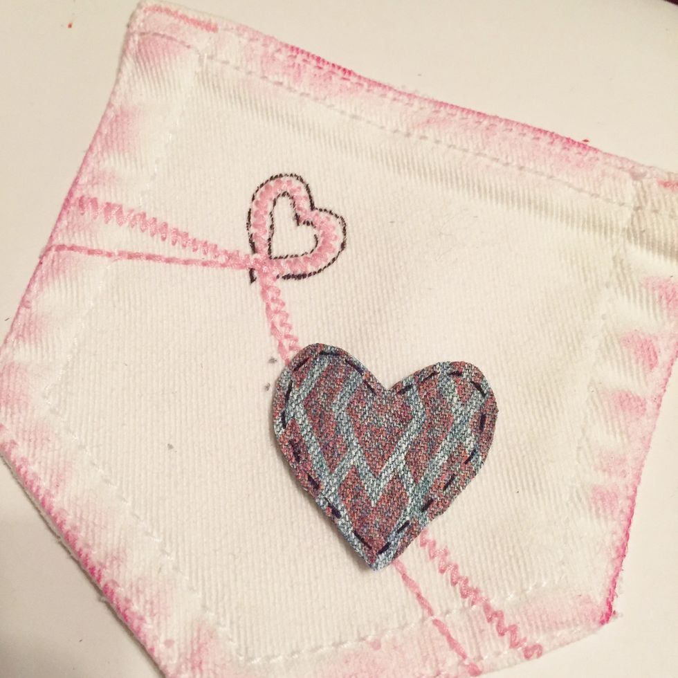 draw in heart - i outlined mine. cut heart from scrap of leftover stamped denim and add stitching lines.