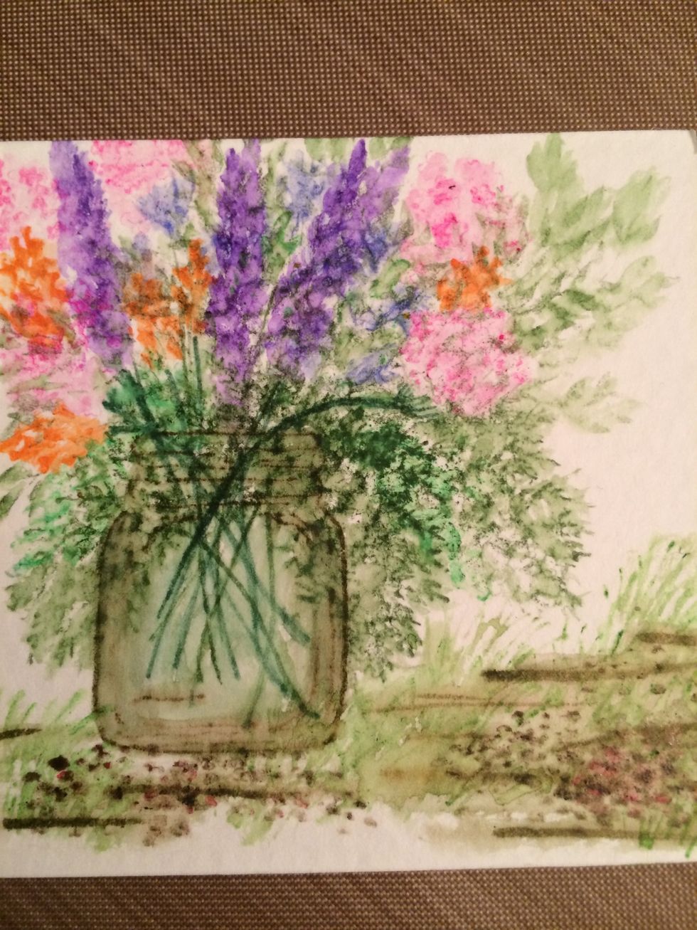 Draw in some lines for the ground and brush with water. Then add some grass and pebbles