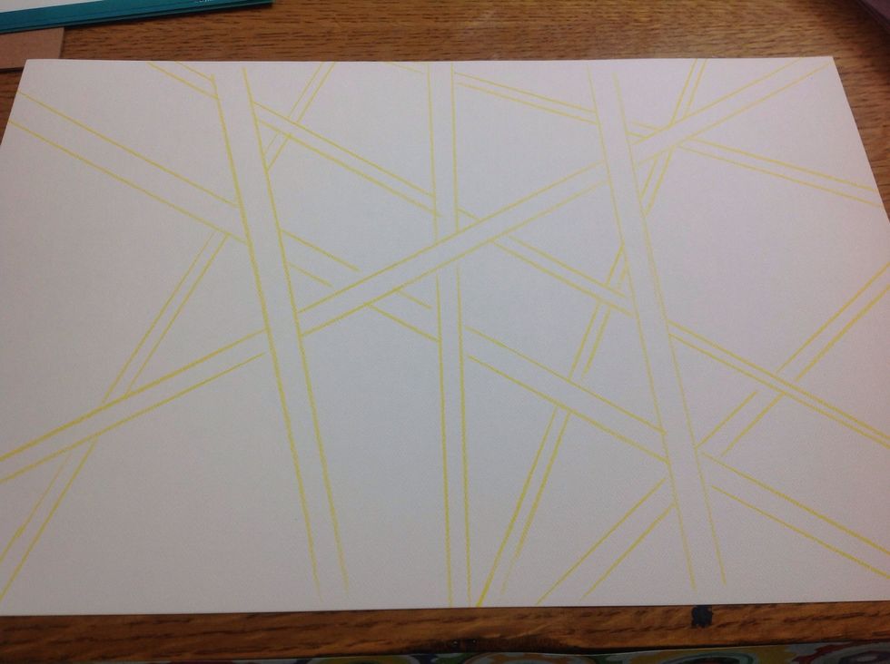 Draw lines on your watercolor paper using a watercolor pencil and a ruler. If you don't have watercolor pencils, use a light yellow colored pencil.