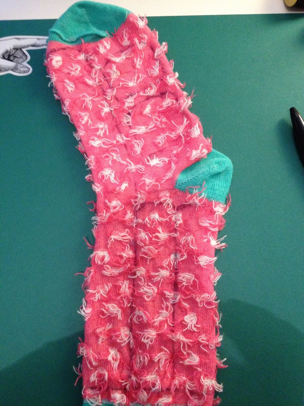 Draw on the tail (on the left side), the ears (on the right top section), and the arms on the bottom right section, and...