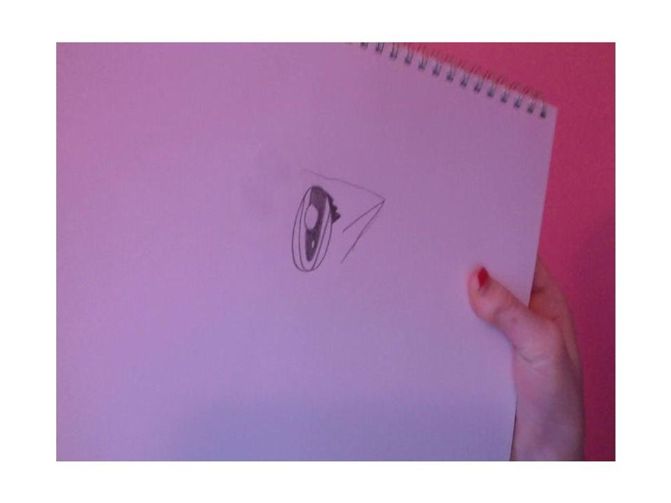 Draw only one eye and draw an ear over to the right of it.