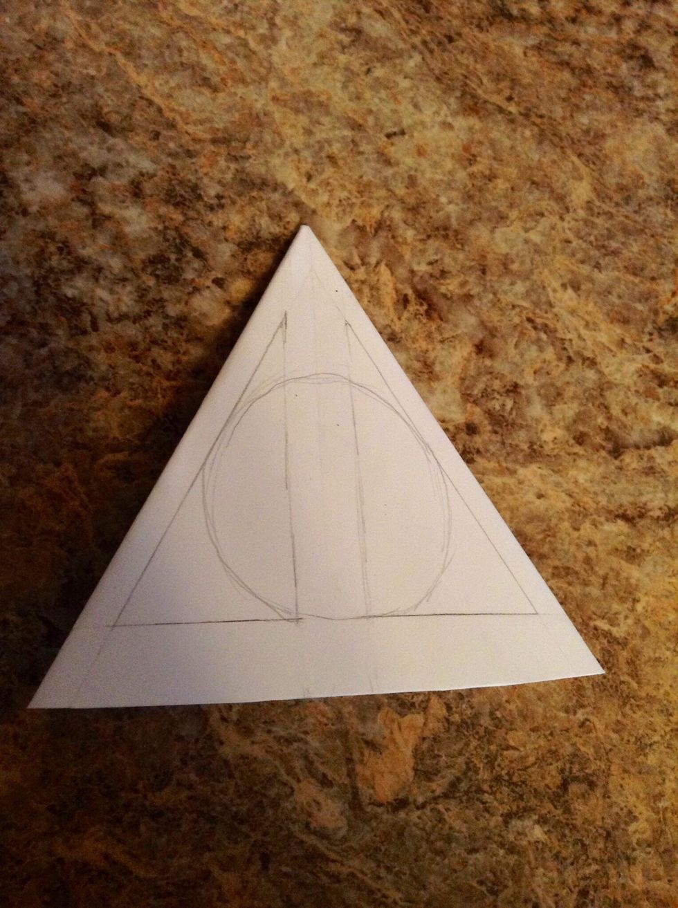 Draw or trace a circle big enough to touch all 3 of the edge lines.