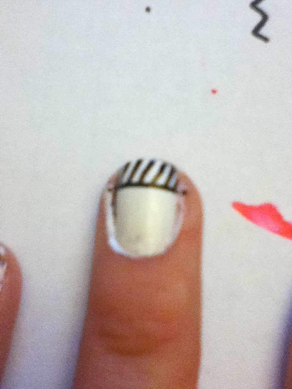 Draw slanted lines connecting to the top of the nail.