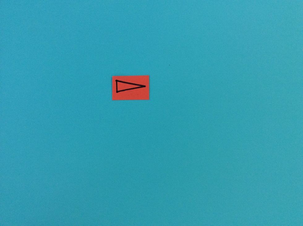 Draw small triangle for the snowman nose.