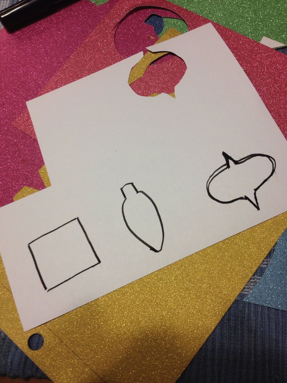 Draw some designs on the back of the glitter paper. I did some ornaments, trees, lights and simple shapes all related to the holidays. \ud83c\udf84\ud83c\udf84\ud83c\udf84\ud83c\udf84\ud83c\udf84\ud83c\udf84\ud83c\udf84\ud83c\udf84\ud83c\udf84\ud83c\udf84\ud83c\udf84\ud83c\udf84\ud83c\udf84\ud83c\udf84\ud83c\udf84