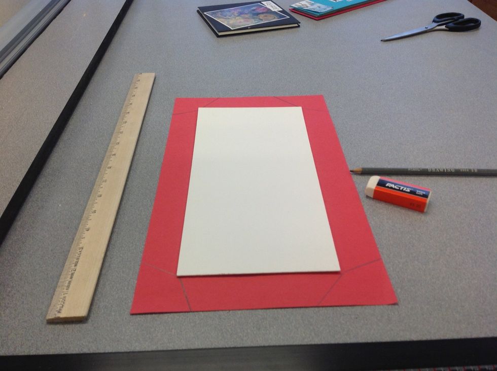 Draw tabs around the sides of each mat board piece that are 1 1/2 inch deep and are trapezoidal.