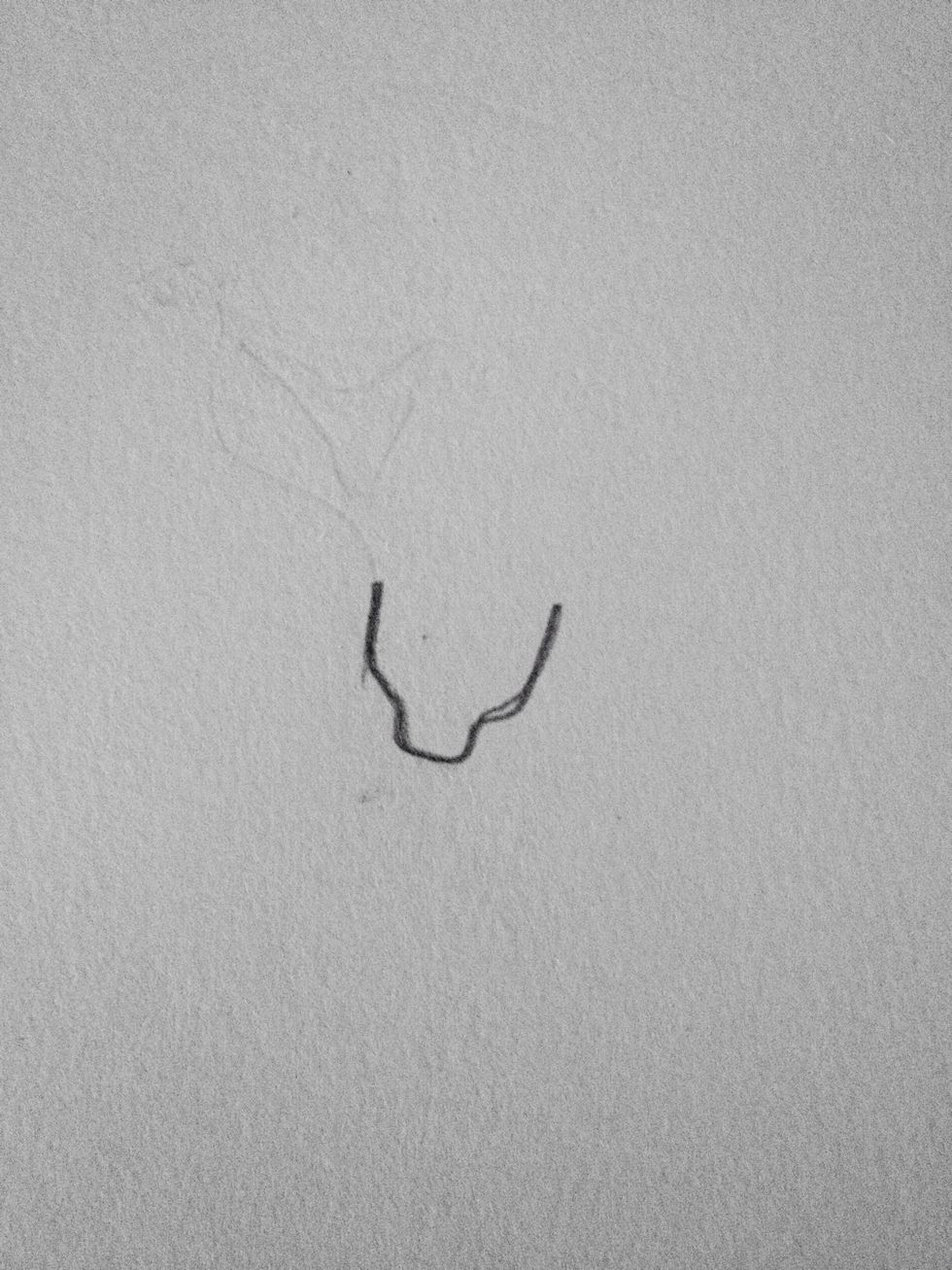 Draw the base of the rose by drawing a small "cup" with a funny base...? Sorry its a bit hard to explain haha!! Do it like this:)