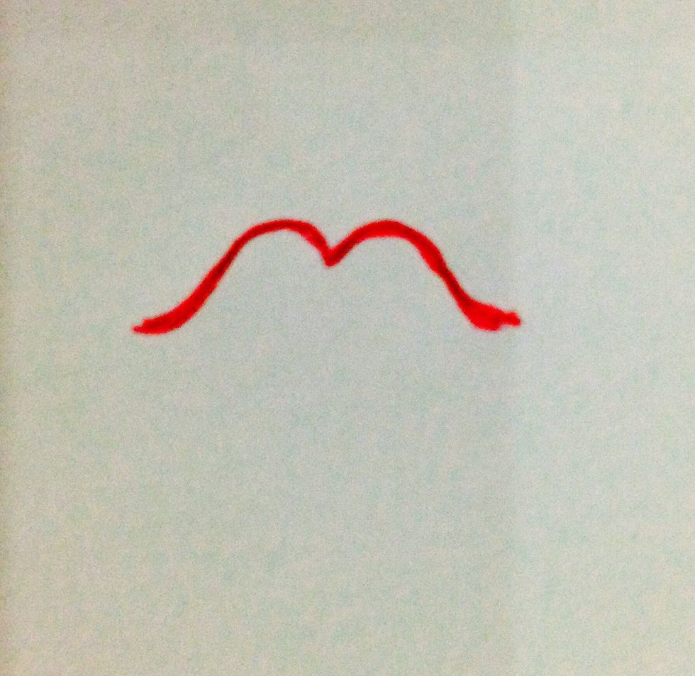 Draw the boundary of the upper lip like this, making it a little heart-shaped.