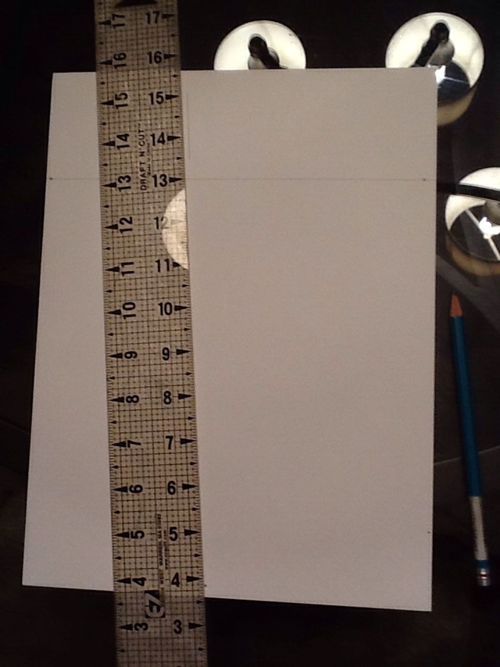 Draw the center line however big you want your box to be. It is above the horizon line so you will see the bottom of the box.
