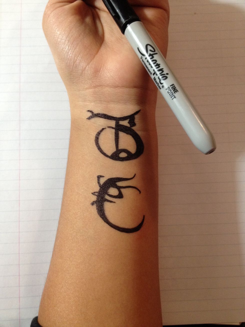 Draw the design on the desired area with your sharpie.