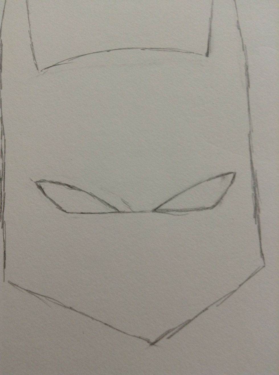 Draw the eyes. If you want them to be even you can draw a line between them and erase it later.