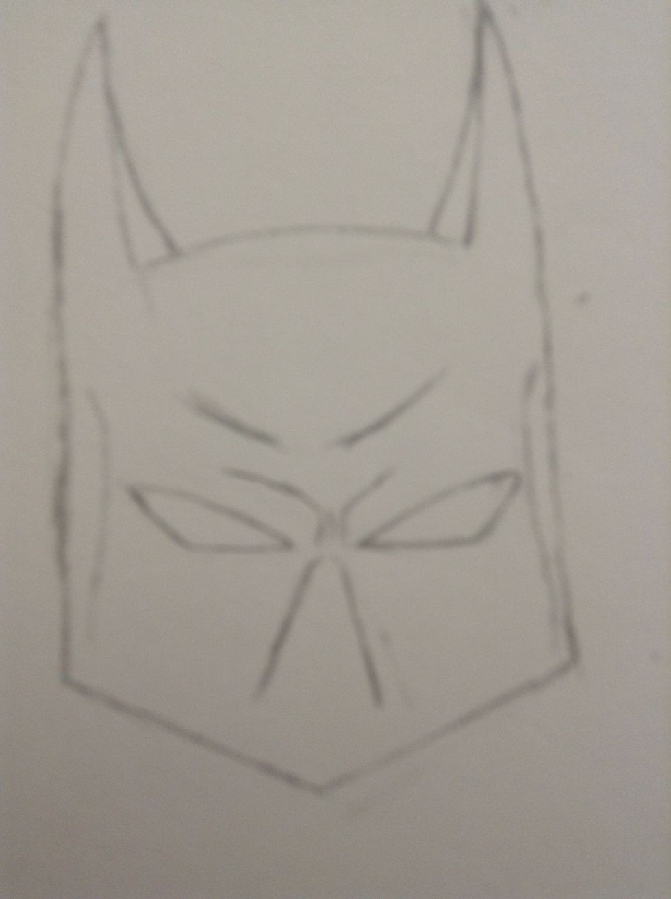 Draw the indentions in the sides of his head.